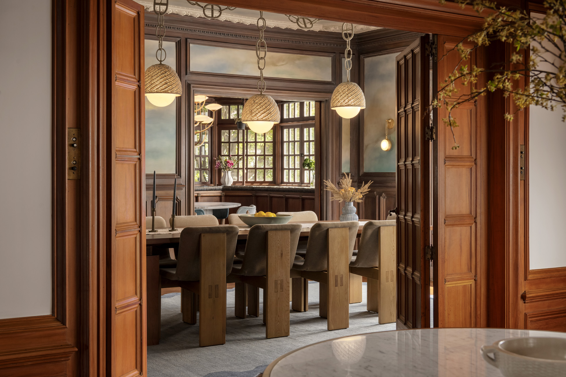 Dining room seen through the foyer's Venetian doors