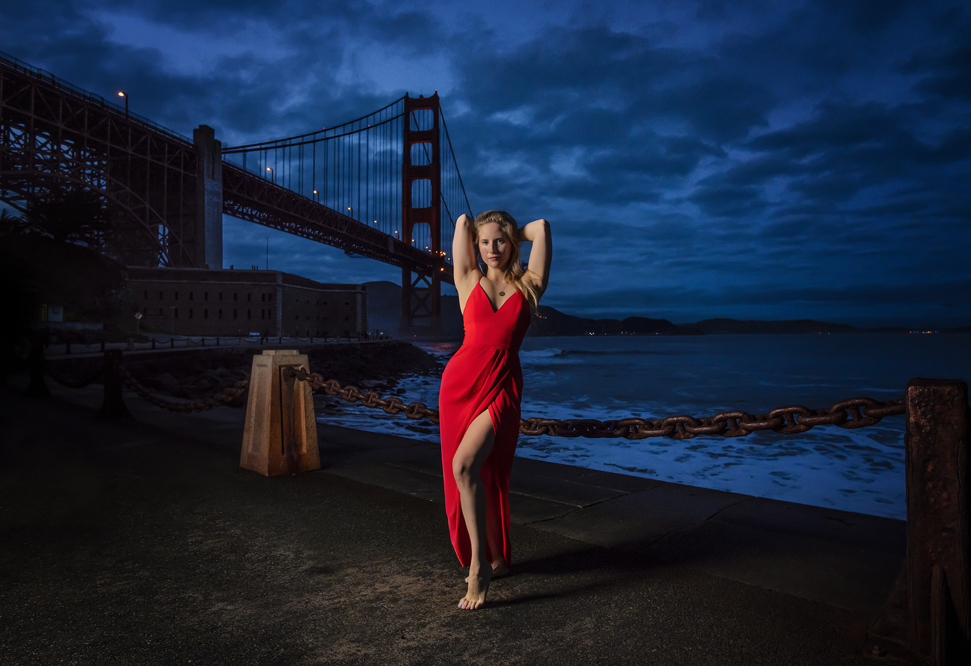 Portrait in a red dress, Golden Gate Bridge at blue hour